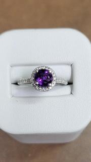 White gold diamond halo engagement ring with amethyst center